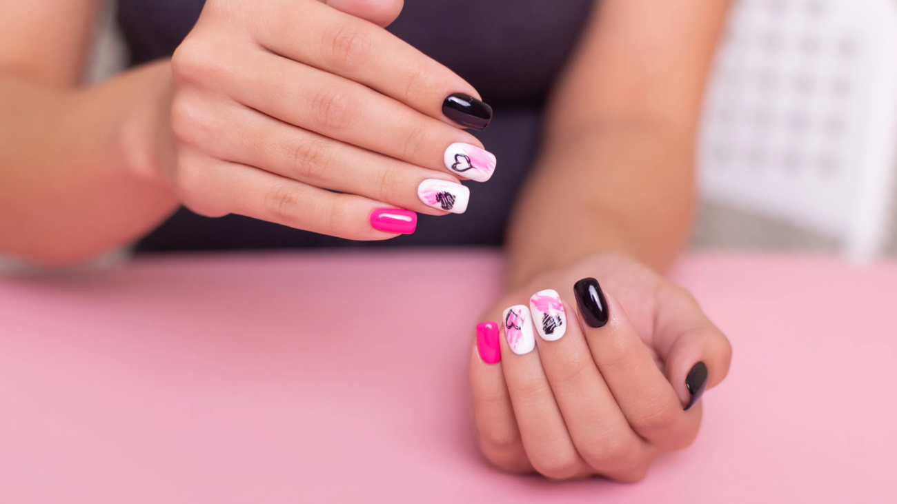 beautiful-female-hands-with-fashion-manicure-nails-hearts-valentine-s-day-design(2)